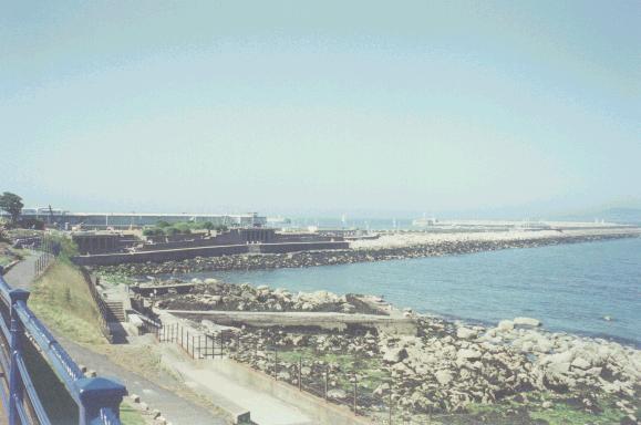 back of D&uacute;n Laoghaire pier; on the left, a part of the Crock's Garden